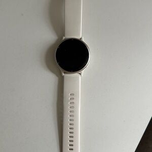 garmin white smartwatch with black display